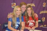 Sami Chedester (left) and Chloe (right) in red with brother Billy in the middle. The two sisters signed letters of intent Thursday, Feb. 15 to play soccer at Fresno State.